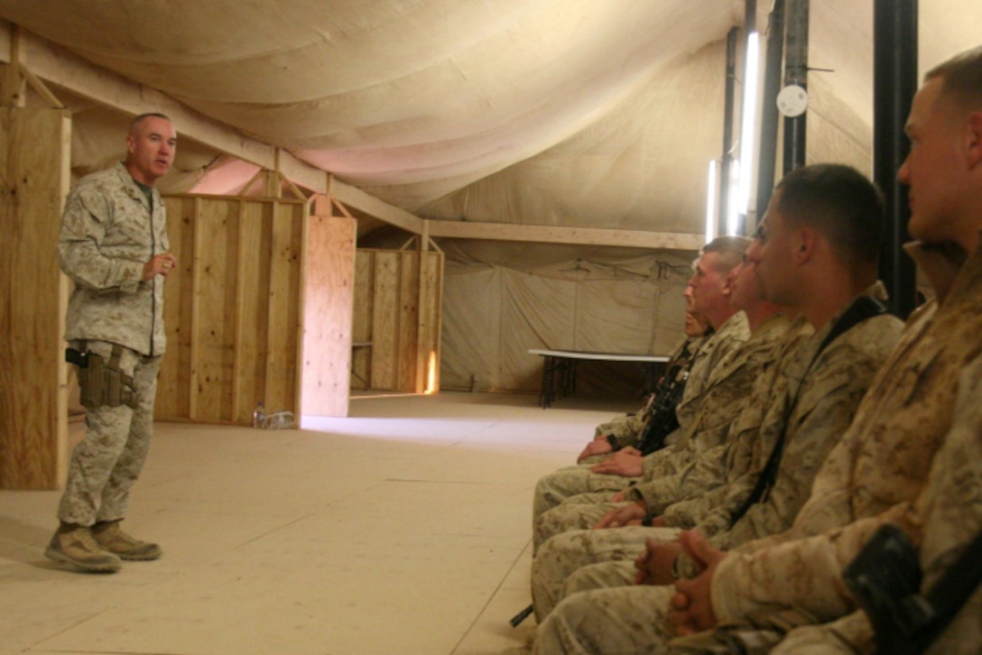 Brig. Gen. Charles L. Hudson, commanding general, 1st Marine Logistics Group (Forward), talks to lance corporals about Marine Corps leadership during the Lance Corporals Seminar graduation ceremony at Camp Dwyer, Afghanistan, Jan. 26. The 3-day seminar aimed to teach the junior Marines the fundamentals of Marine Corps leadership in preparation for when they become noncommissioned officers.