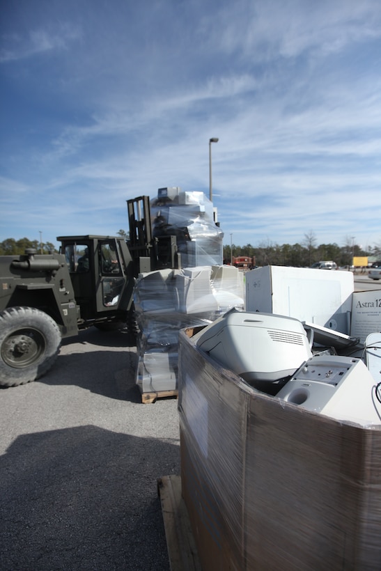 Electronic equipment dropped off at this year’s first Electronics Recycling Event aboard Marine Corps Base Camp Lejeune, sits in stacks waiting to be loaded and shipped off where they will be recycled, Jan. 27. The event gives base personnel a chance to properly dispose of electronics, many of which have chemicals harmful to the environment as well as materials that can be recycled and reused in newer electronics.