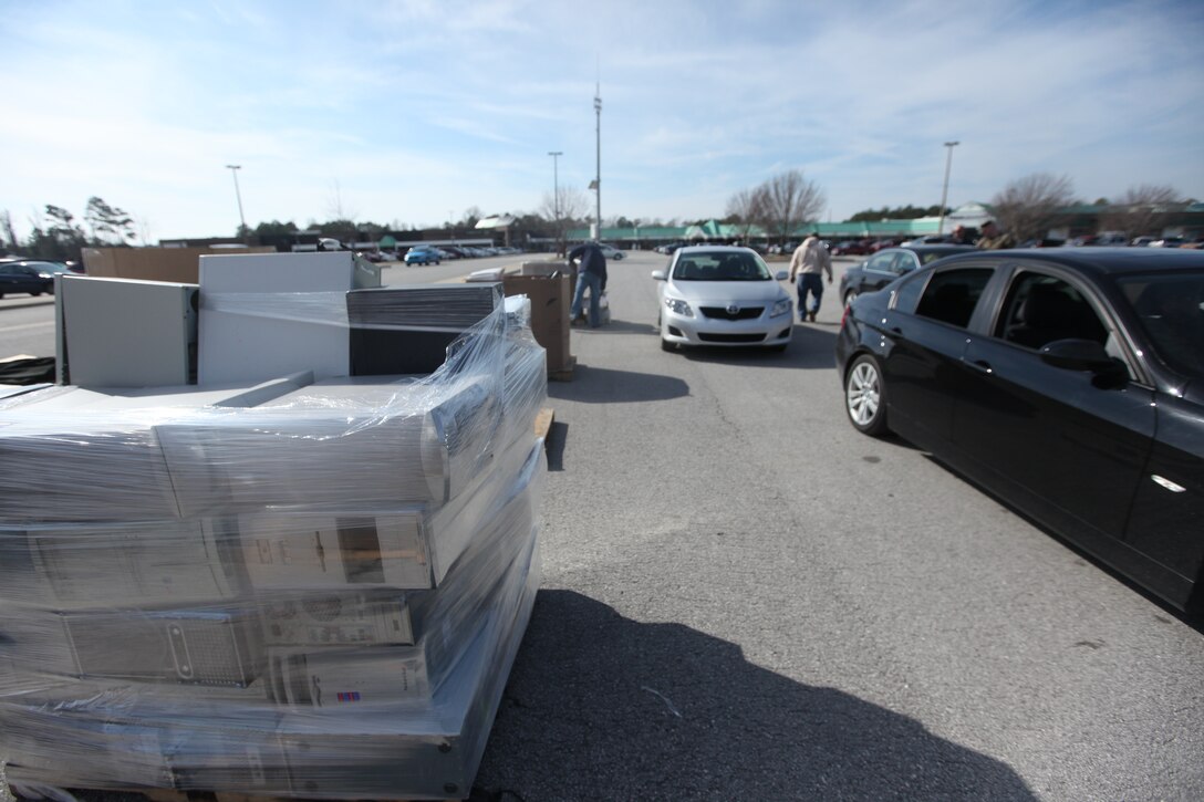 Vehicles wait to be unloaded during the year’s first Electronics Recycling Event aboard Marine Corps Base Camp Lejeune, Jan. 27. The event gives base personnel a chance to properly dispose of electronics, many of which have chemicals harmful to the environment as well as materials that can be recycled and reused in newer electronics.