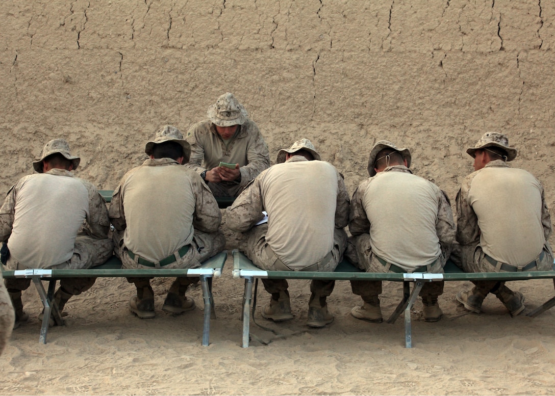 U.S. Marine Corps Sgt.  Schultz, a combat engineer attached to Company L, Battalion Landing Team 3/8, 26th Marine Expeditionary Unit, Regimental Combat Team 2, relays information from the intelligence brief to his Marines in Helmand province, Afghanistan, Jan. 27, 2011. Elements of the 26th Marine Expeditionary Unit deployed to Afghanistan to provide regional security in Helmand province in support of the International Security Assistance Force. (U.S. Marine Corps photo by Sgt.  Jesse J. Johnson/ Released)::r::::n::