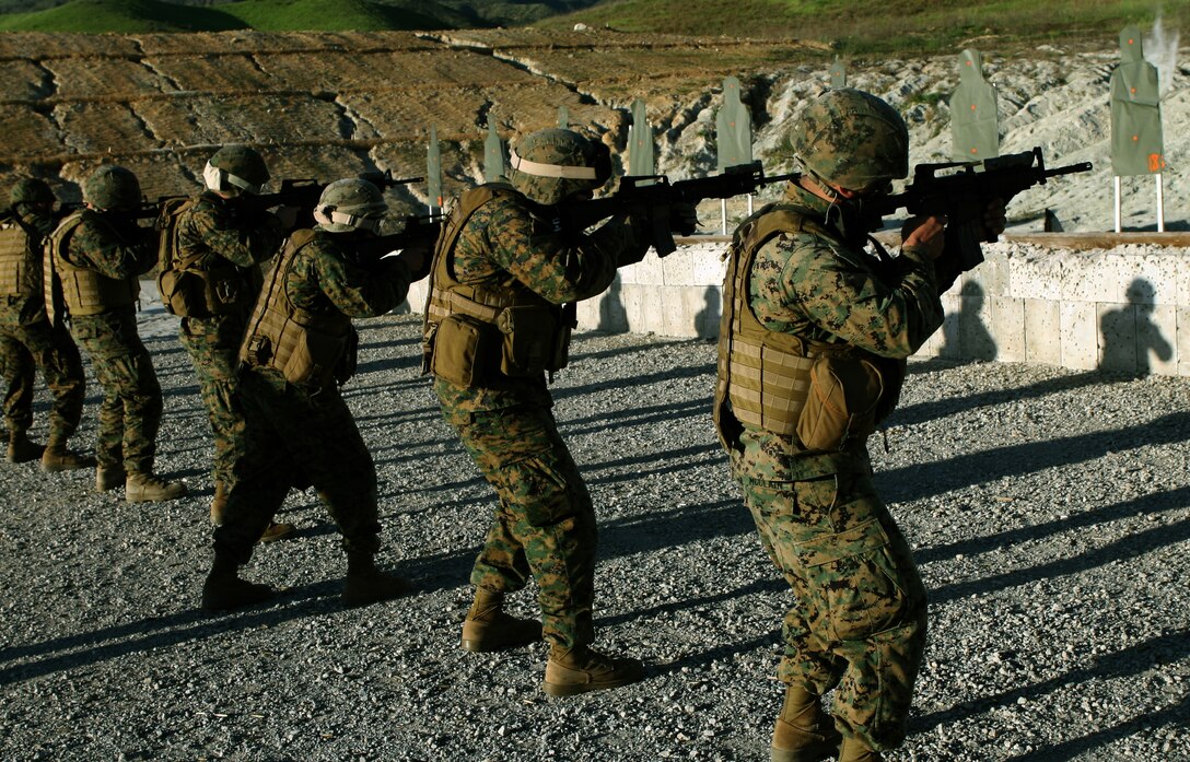 While training with the ground combat element, Lance Cpl. Austin T. Woods, a rifleman with Black Sea Rotational Force-11, Camp Pendleton, shoots Table 3 drills for the Combat Marksmanship Program.  In addition to marksmanship, the Special Purpose Marine Air ground Task Force will receive training in urban warfare, convoy operations and cultural awareness in preparation to advise foreign militaries in the Black Sea, Balkan and Caucasus regions.