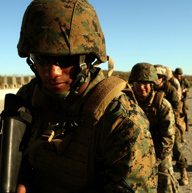 Finished with a failure-to-stop drill, Sgt. Jeff R. Kunkel, a squad leader for the ground combat element, Black Sea Rotational Force-11, Camp Pendleton, Calif., waits for instructions for the combat marksmanship instructors. Over 100 reserve Marines from across the nation began their pre-deployment training here, including cultural awareness and military advising training, in preparation for the Special Purpose Marine Air Ground Task Force deploying to the Black Sea, Balkan and Caucasus regions.