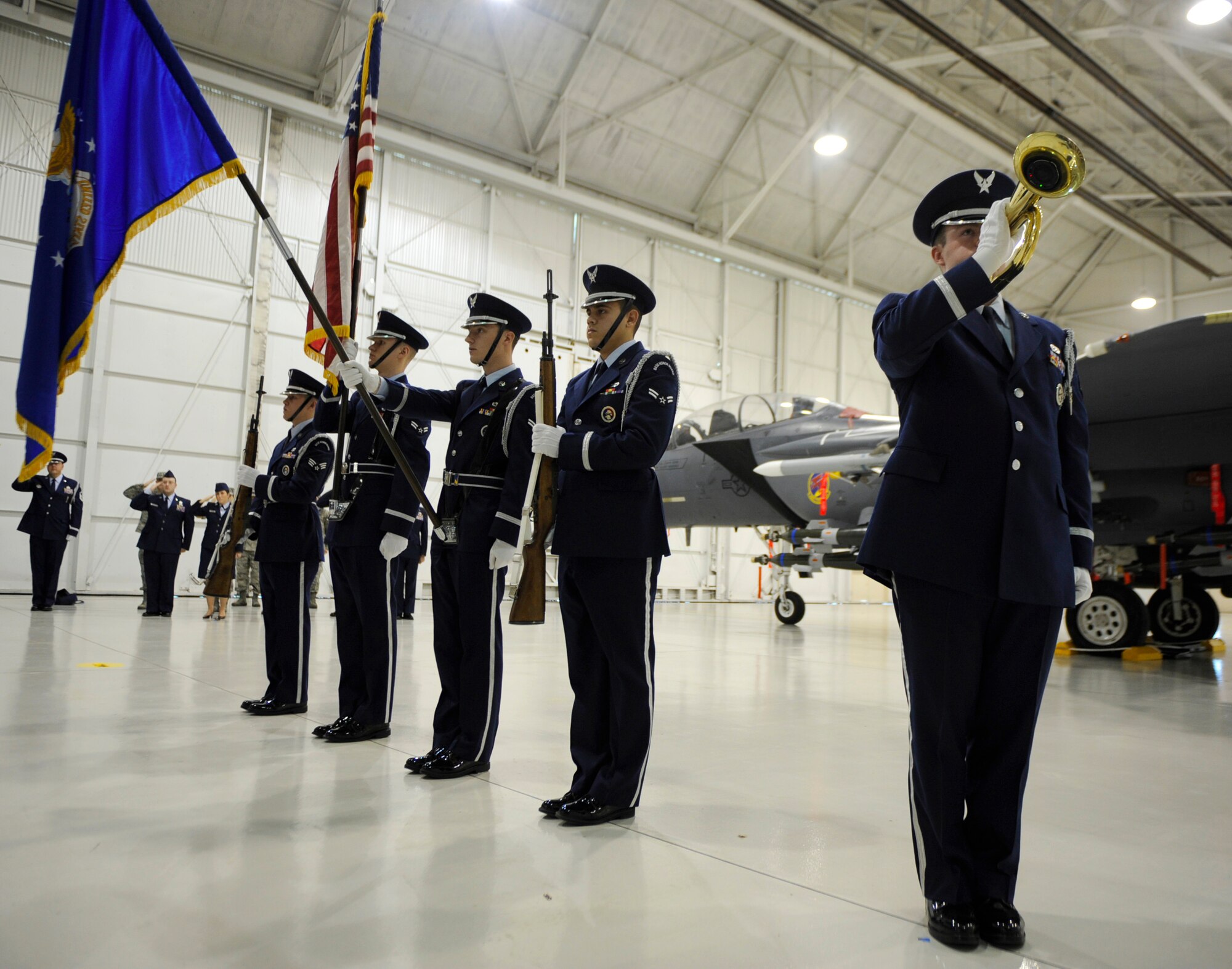 MOUNTAIN HOME AIR FORCE BASE, Idaho –An  Honor Guard Airman play Taps during the memorial service held for Airman Jamie Burroughs in Hangar 1331 Jan. 27. Airman Burroughs passed away in a vehicle rollover. (U.S. Air Force photo by Senior Airman Renishia Richardson)