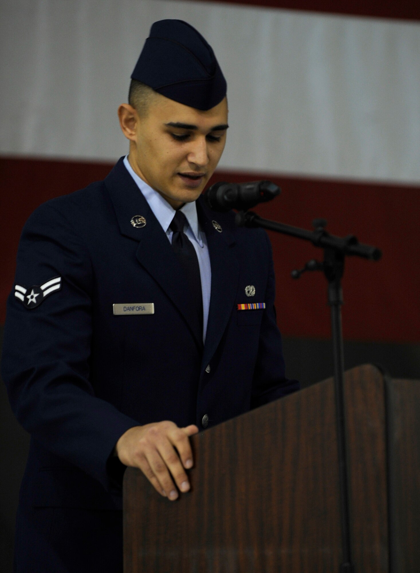 MOUTAIN HOME AIR FORCE BASE, Idaho -- Airman 1st Class Jacob Danfora, 366th Equipment Maintenance Squadron precision guided missile crew member, speaks during the memorial service for Airman Jamie Burroughs Jan. 27 held in Hangar 1331. Airman Burroughs was assigned to the 366th Equipment Maintenance Squadron and passed away in a vehicle rollover. (U.S. Air Force photo Senior Airman Renishia Richardson)