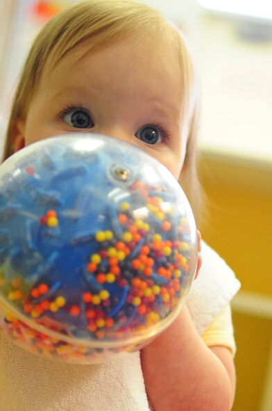 Peyton Spare, 7 months, daughter of Airman 1st Class Sarah Spare, 2nd Communications Squadron, plays with a ball at the Barksdale Child Development Center located on Barksdale Air Force Base, La., Jan. 27. The CDC not only provides childcare weekly to military members and Department of Defense civilians, but also offers a bi-monthly ‘Give Parents a Break’ program for parents with deployed spouses. For more information about the Give Parents a Break program, contact the Airman and Family Readiness Center at 456-8400. (U.S. Air Force photo/Senior Airman Joanna M. Kresge)