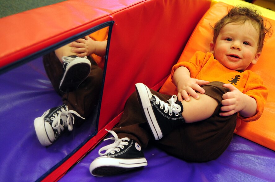Lucas Layman, 8 months, lounges in a climber play center at the Barksdale Child Development Center located on Barksdale Air Force Base, La., Jan. 27. Lucas is the son of Tech. Sgt. TaraShawn Layman, 2nd Medical Support Squadron and Staff Sgt. Brandon Layman, 2nd Civil Engineer Squadron. The CDC, which is Department of Defense certified and accredited by the National Association for the Education of Young Children, provides childcare for military and DoD civilian children during the duty week. (U.S. Air Force photo/Senior Airman Joanna M. Kresge)