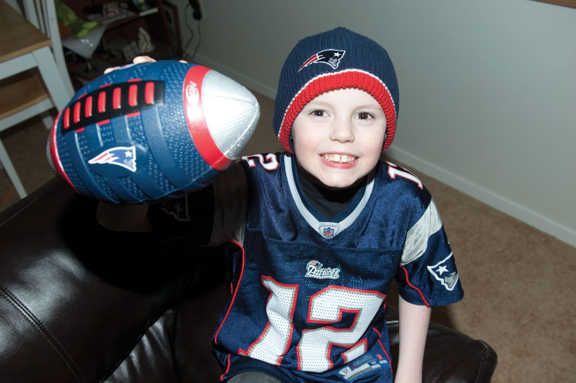 Cole Larlee sports the gear of his favorite team the New England Patriots. (U.S. Air Force photo/SSgt Jeremy Larlee)