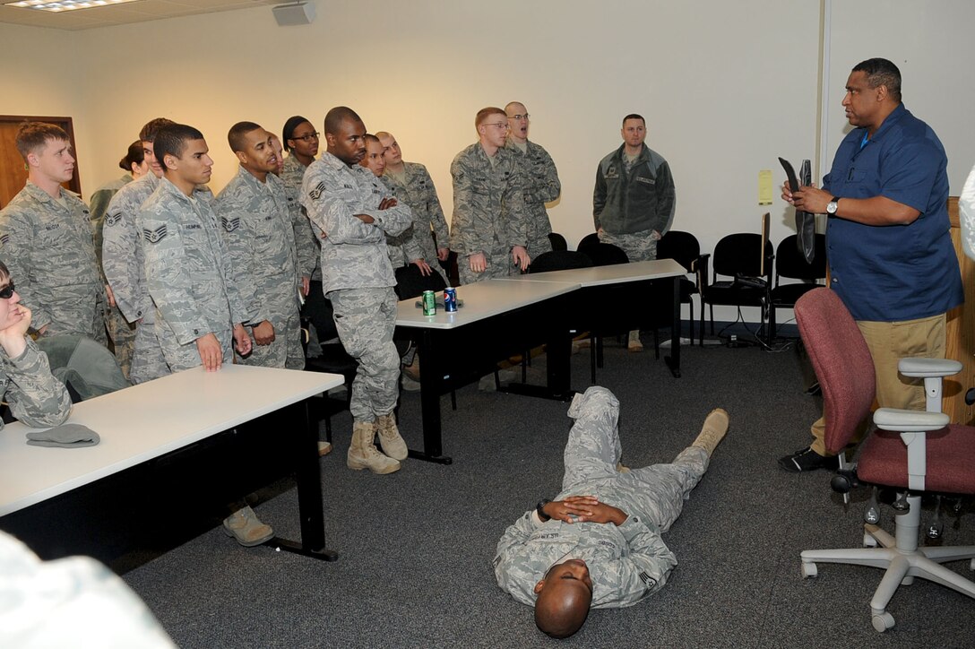 LANGLEY AIR FORCE BASE, Va. -- William Rupert, instructor with the 633d Security Forces Squadron, explains how to splint a fracture during self aid/buddy care Jan. 21. Security Forces consolidated on-the-job training into a month-long battery of required tasks to minimize the impact on day-to-day operations. (U.S. Air Force photo/Staff Sgt. Ashley Hawkins)(RELEASED)
