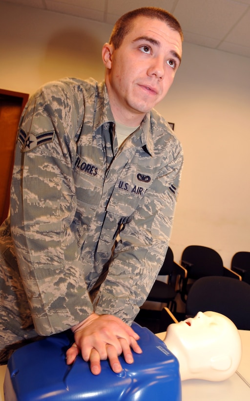 LANGLEY AIR FORCE BASE, Va. – Airman 1st Class Corie Flores, 633d Security Forces Squadron installation entry controller, performs chest compressions on a training dummy during a CPR class Jan. 27.  The CPR certification class was part of the Squadron’s month-long training course, which included classes on integrated defense, self-aid and buddy care and active-shooter scenarios.  (U.S. Air Force photo/Staff Sgt. Logan Tuttle)(RELEASED)

