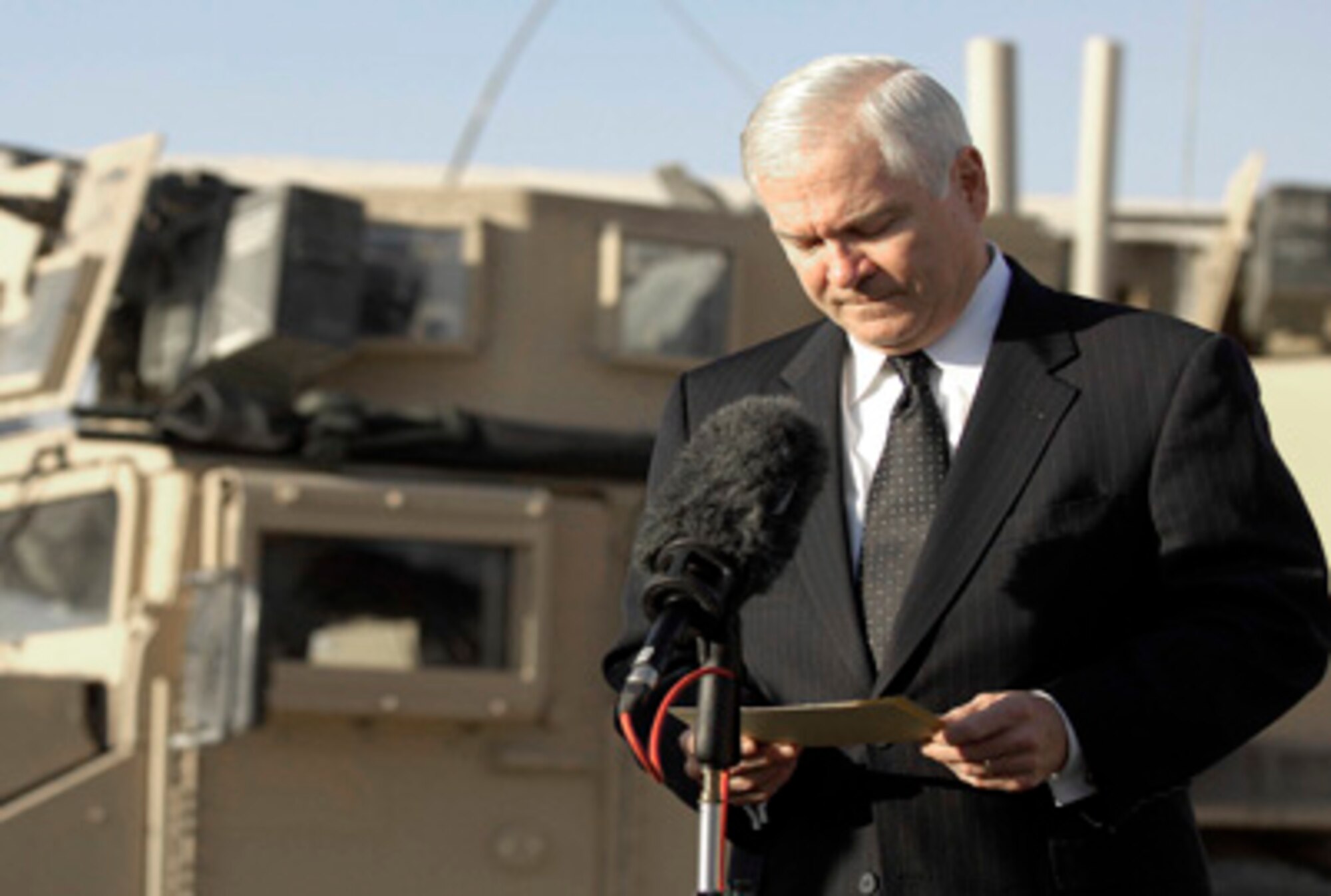 Secretary of Defense Robert M. Gates looks over his notes as he talks with members of the press on Kandahar Air Field, Afghanistan, Dec. 11, 2008. Recently, Secretary Gates addressed the failure of Congress so far to pass the fiscal 2011 defense appropriations bill, which creates the possibility of funding the department under a year-long continuing resolution instead, is "the crisis on my doorstep."  (DOD photo/Tech. Sgt. Jerry Morrison)