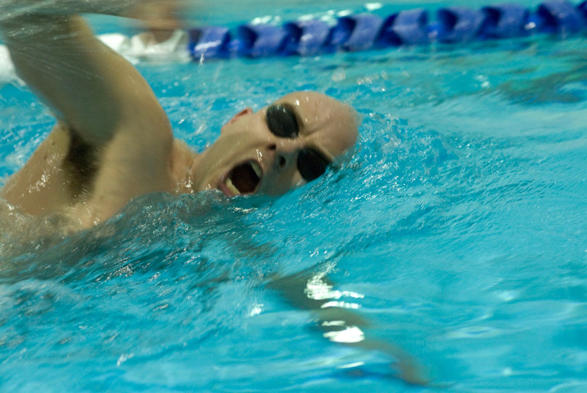 Tech. Sgt. Jeromie Sandall, 381st Intelligence Squadron, swims one of his 24 laps in 20 minutes during the triathlon held at the Elmendorf Fitness Center. (U.S. Air Force photo/Steve White)