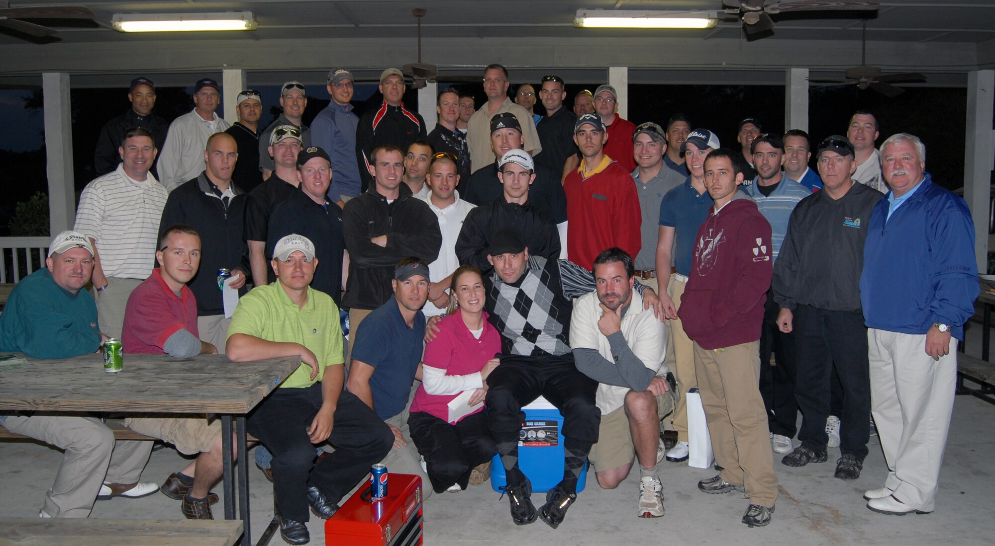 Members of the Pope Special Activities Committee along with Airmen from Pope, pose for a group photo after a long day of golf during the annual PSAC Golf Tournament on Nov. 5. Funds raised from the tournament will be used to support Pope Airmen and families through a variety of programs which were designed with them in mind. (U.S. Air Force photo/Vicki Johnson)