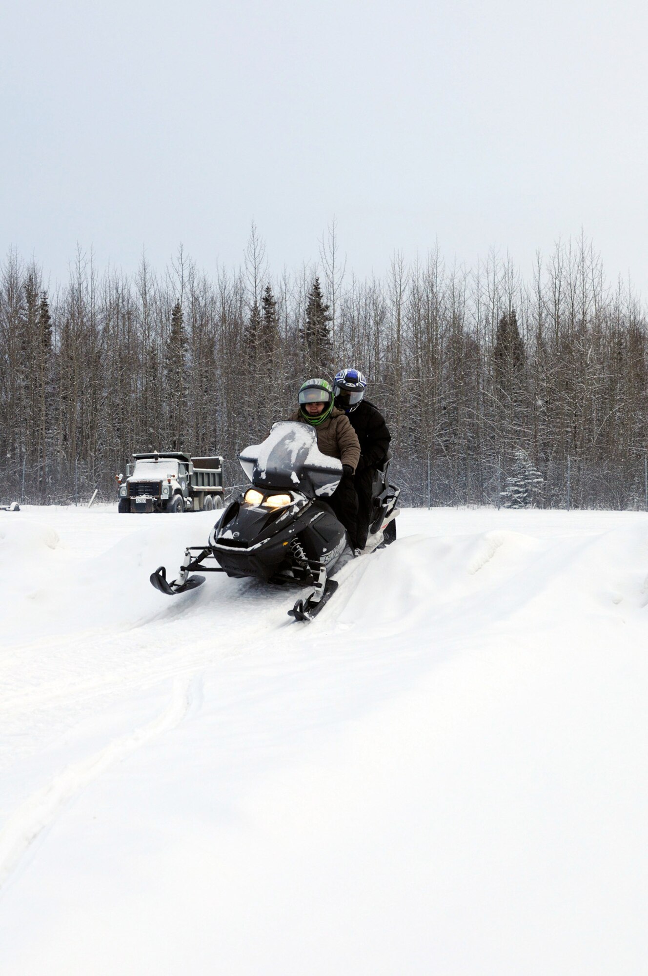 Melissa Sigllen and husband Dennis going through the pactical portion of the snowmobile trainig class. (U.S. Air Force photo/Steve White)
