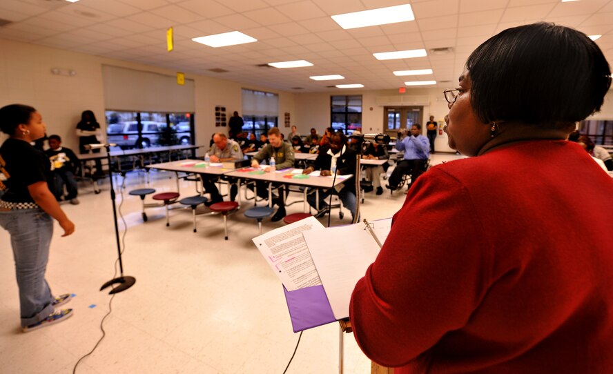 VALDOSTA, Ga.--  Dr. Beverley Richardson-Blake, pronouncer for the King and Queen Spelling Bee at William Gaines Nunn Elementary school, announces a word to be spelled Jan. 21. (U.S. Air Force photo/Airman 1st Class Joshua Green)(RELEASED)
