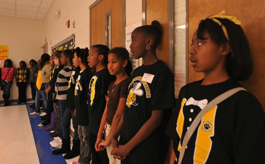 VALDOSTA, Ga.-- Students from the “Chorus Cats” choir, sing songs before the start of a spelling bee at William Gaines Nunn Elementary School Jan. 21. The spelling bee competition had 16 students from the fourth and fifth grades competing for first place. (U.S. Air Force photo/Airman 1st Class Joshua Green)(RELEASED)
