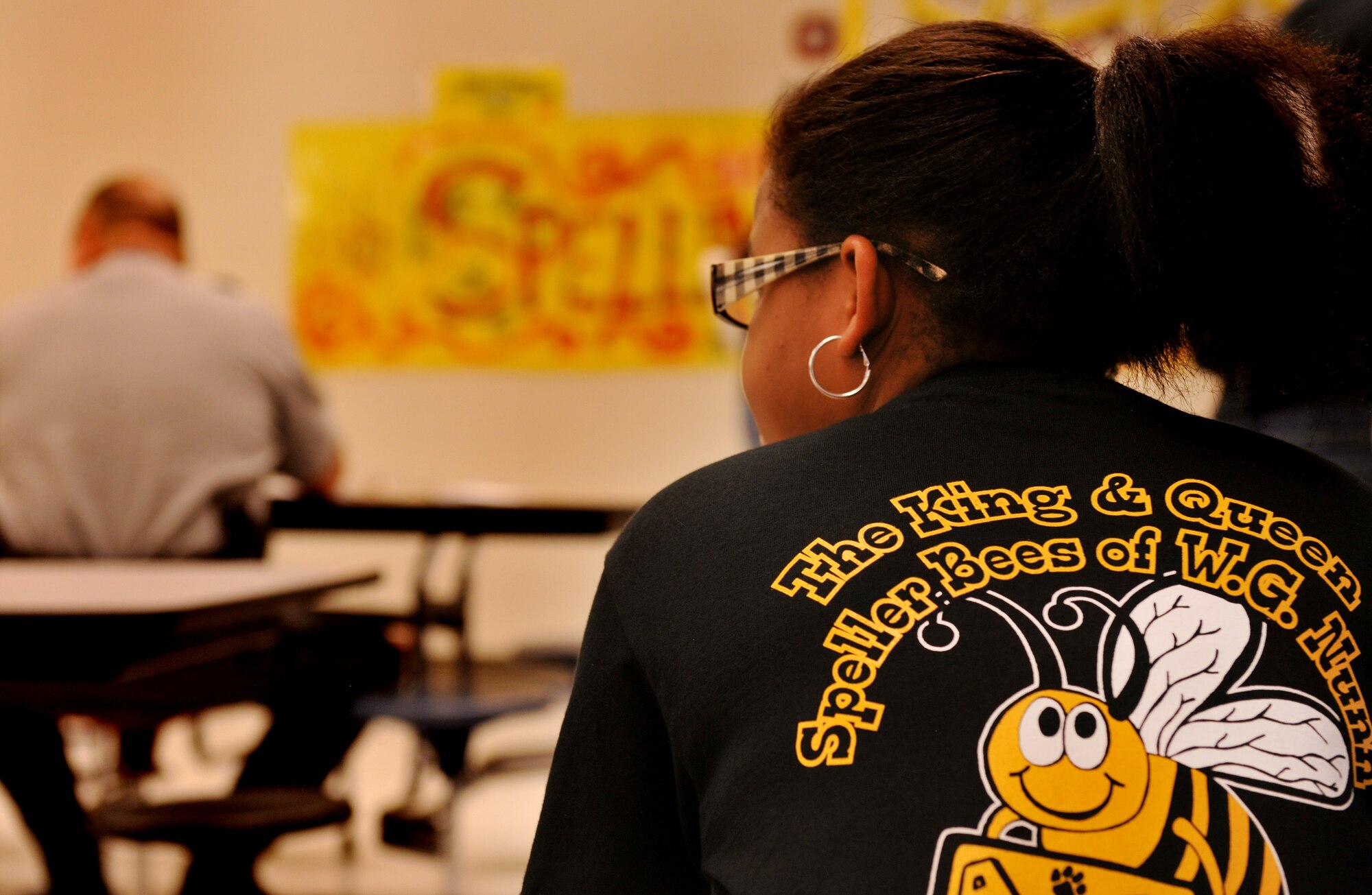 VALDOSTA, Ga.-- A student wears a T-shirt that says “The King and Queen Speller Bees of W. G. Nunn Elementary school”  Jan. 21. This is the 2nd annual spelling bee for the school who invited guests from around the community, including Col. Gary Henderson, 23rd Wing commander, to participate and help judge. (U.S. Air Force photo/Airman 1st Class Joshua Green)(RELEASED)
