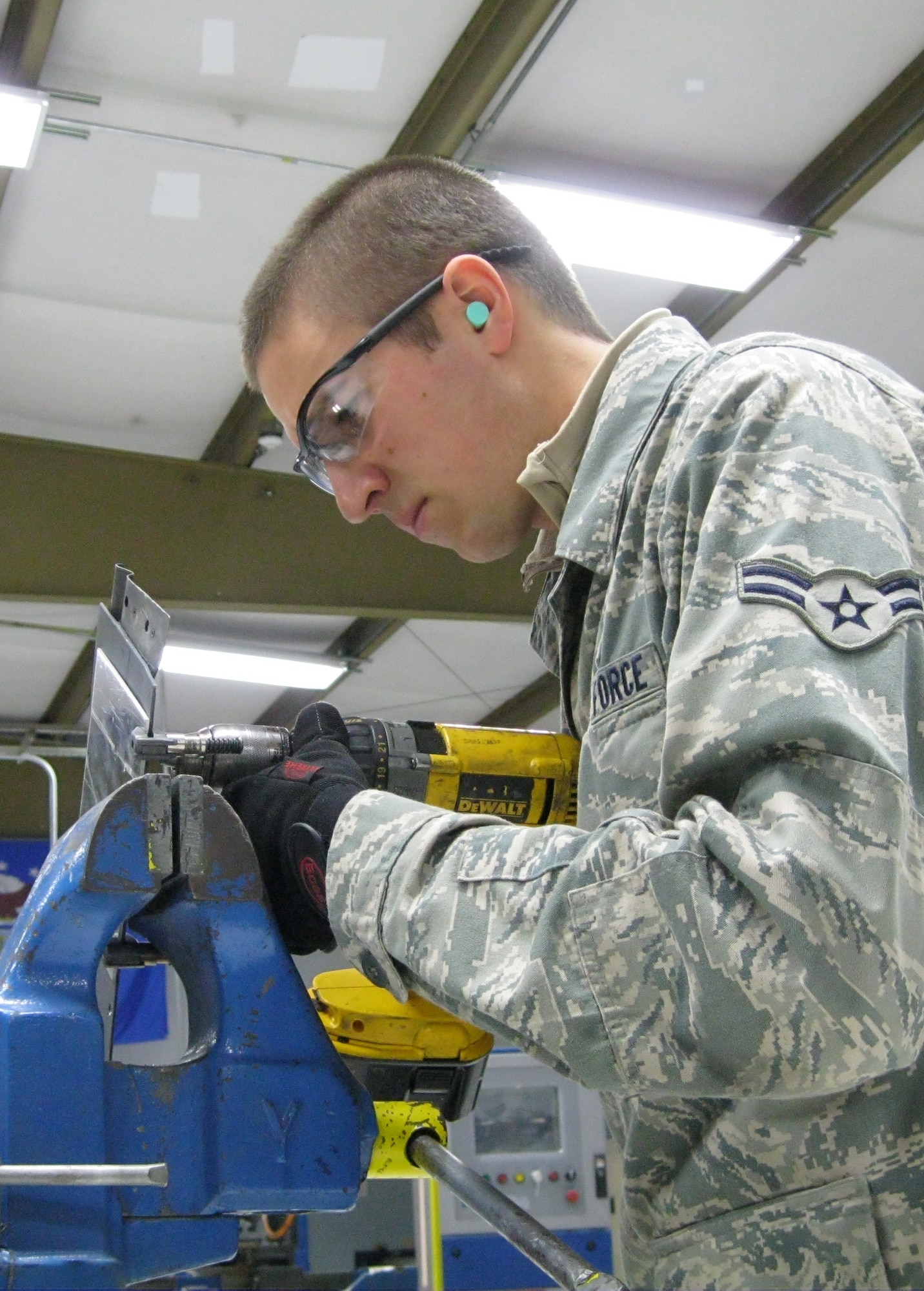 SEYMOUR JOHNSON AIR FORCE BASE, N.C. – Airman 1st Class David Kebker assembles a F-15E Strike Eagle repair patch here Jan. 25, 2011. After aircraft structural maintenance Airmen arrive at their first duty station they receive certification on approximately 150 tasks during 12-months of on the job training. Airman Kebker, 4th Equipment Maintenance Squadron aircraft structural maintenance journeyman, hails from Pousbo, Wash. (U.S. Air Force photo/Tech. Sgt. Tammie Moore) (RELEASED)