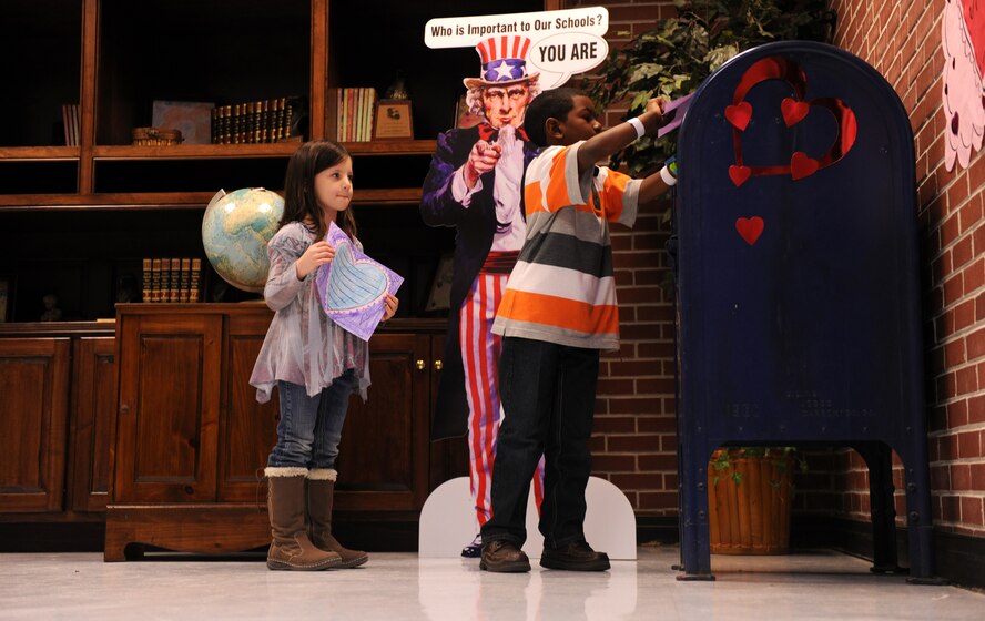 LAKELAND, Ga.-- Noah Jenkins and Caitlyn Coleman, Lanier County Primary School second-grade students, drop their Valentine’s Day cards off at a mailbox Jan. 25. All of the cards made by the students will be collected in the mailbox and then delivered to deployed service members in Afghanistan by Valentine’s Day. (U.S. Air Force photo/Airman 1st Class Benjamin Wiseman)(RELEASED)