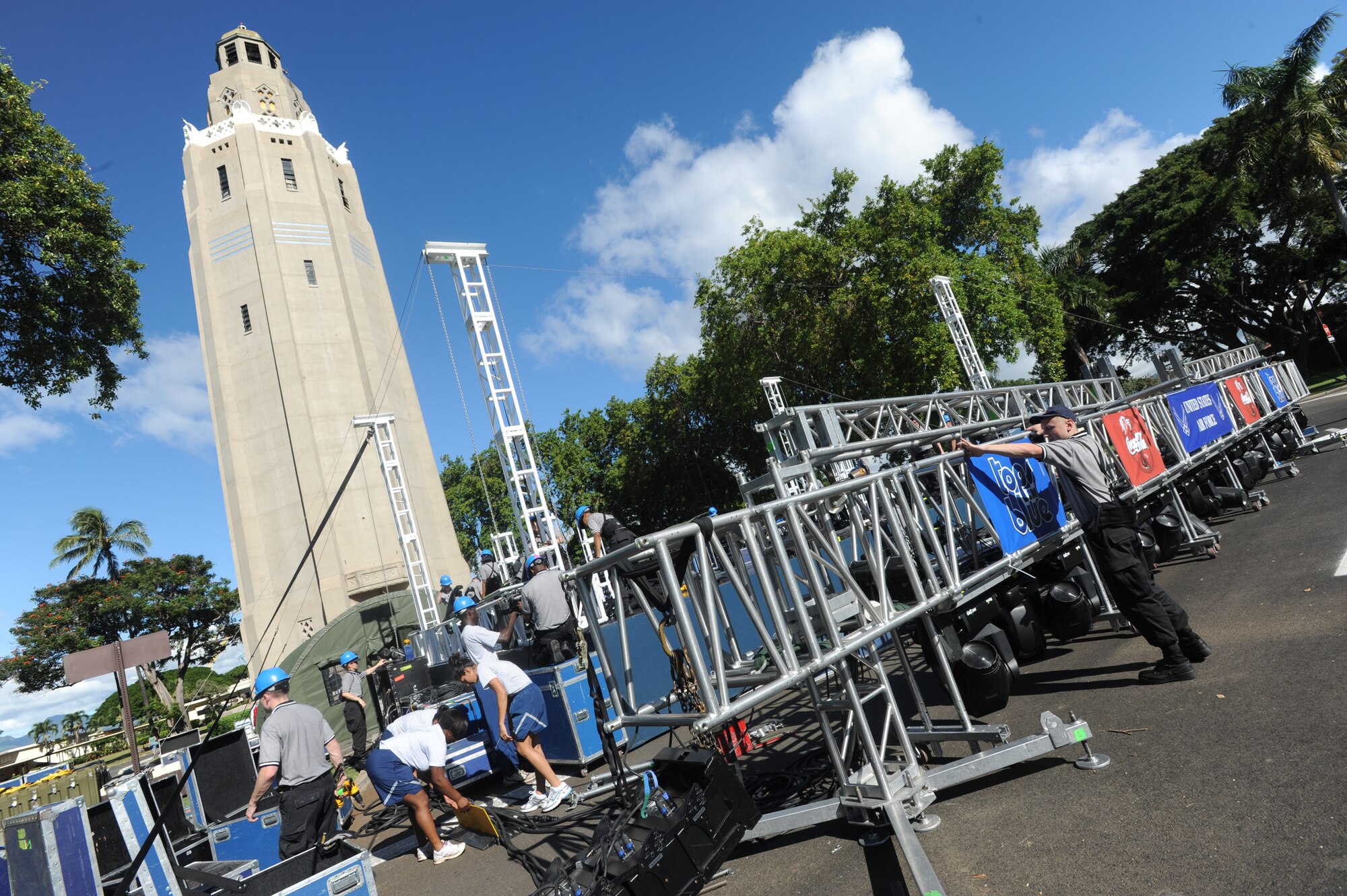 Airmen from Tops in Blue assemble the stage in preparation for their Jan, 26 performance at Freedom Tower on Joint Base Pearl Harbor-Hickam, Hawaii. Before each performance, the Airmen of Tops in Blue unload and set up more than 80,000 pounds of equipment and use more than two miles of electrical cable. (U.S. Air Force Photo/Airman 1st Class Lauren Main)