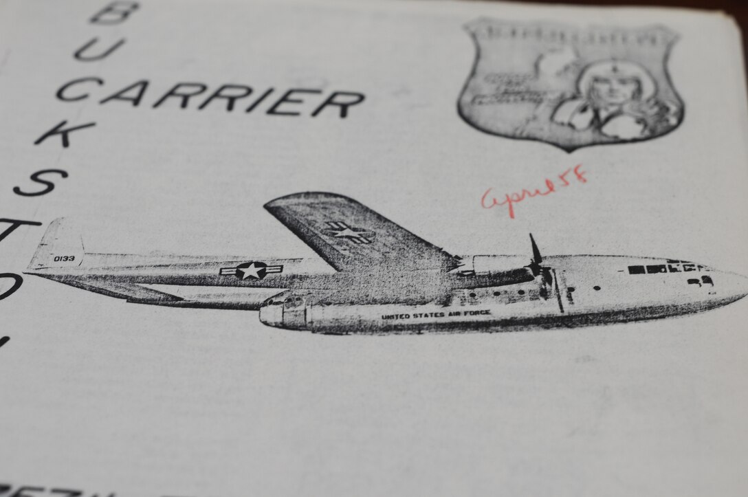 The April 1958 issue of Buckstone Carrier features a sketch of a C-119 "Flying Boxcar," tail number 0133, in flight. U.S. Air Force photo by Mr. Eric M. White