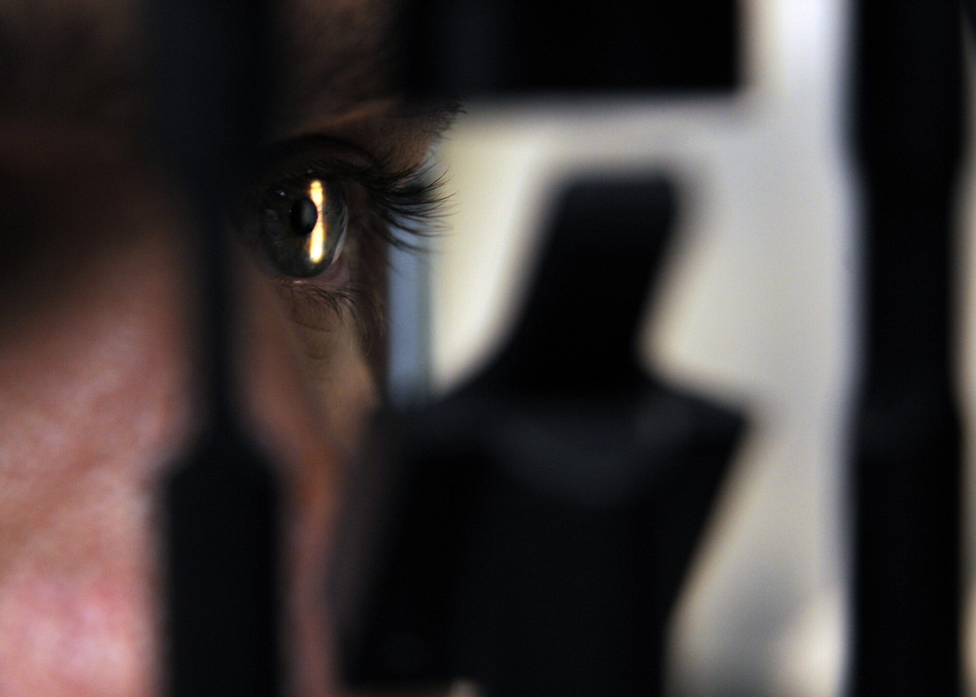 Staff Sgt. Michael Schocker, 22nd Air Refueling Wing broadcaster, receives an examination with a slit lamp at the optometry clinic, Jan. 25, 2011, McConnell Air Force Base, Kan.  The slit lamp checks internal and external eye health. (U.S. Air Force photo/Staff Sgt. Dallas Edwards)