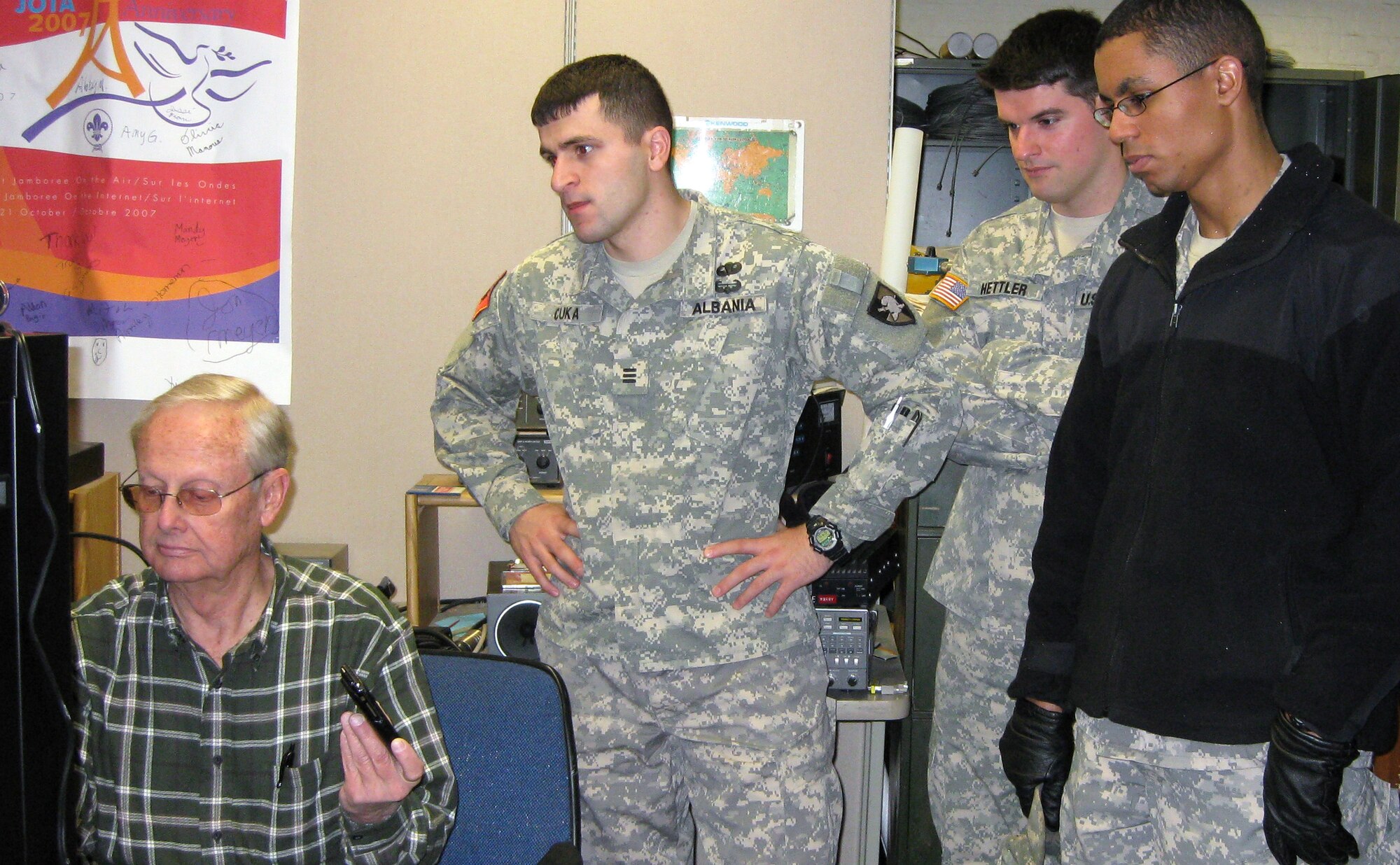 John Clark, left, trains U.S. Military Academy cadets on the new electronics suite that will allow them to contact the Air Force Academy's FalconSAT-3 satellite. Mr. Clark, who works for the Air Force Academy's Department of Astronautics, installed the suite in West Point's Bartlett Hall to allow cadets from both service academies to operate FalconSAT-3 jointly. (U.S. Army photo)