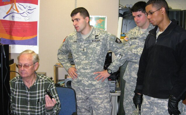 John Clark, left, trains U.S. Military Academy cadets on the new electronics suite that will allow them to contact the Air Force Academy's FalconSAT-3 satellite. Mr. Clark, who works for the Air Force Academy's Department of Astronautics, installed the suite in West Point's Bartlett Hall to allow cadets from both service academies to operate FalconSAT-3 jointly. (U.S. Army photo)