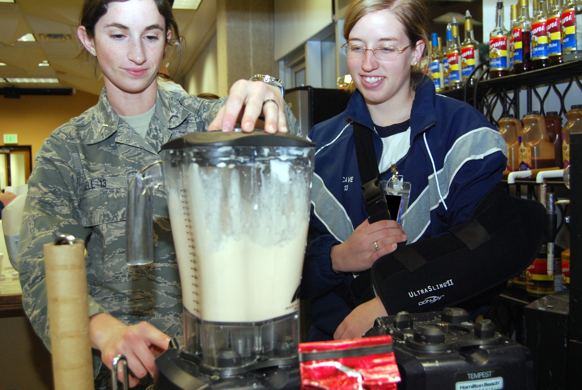 Cadets 3rd Class Heather Udell, left, and Christina Cave prepare a vanilla milkshake in the Air Force Academy's Oasis lounge Jan. 26, 2011. The lounge's amenities include a coffee bar, game consoles, a massage chair and a piano. The Oasis, sponsored by the Academy chapel, allows cadets to take a break from the rigors of Academy life and come together in a more casual environment. Cadets Udell and Cave are assigned to Cadet Squadron 25. (U.S. Air Force photo/Staff Sgt. Don Branum)