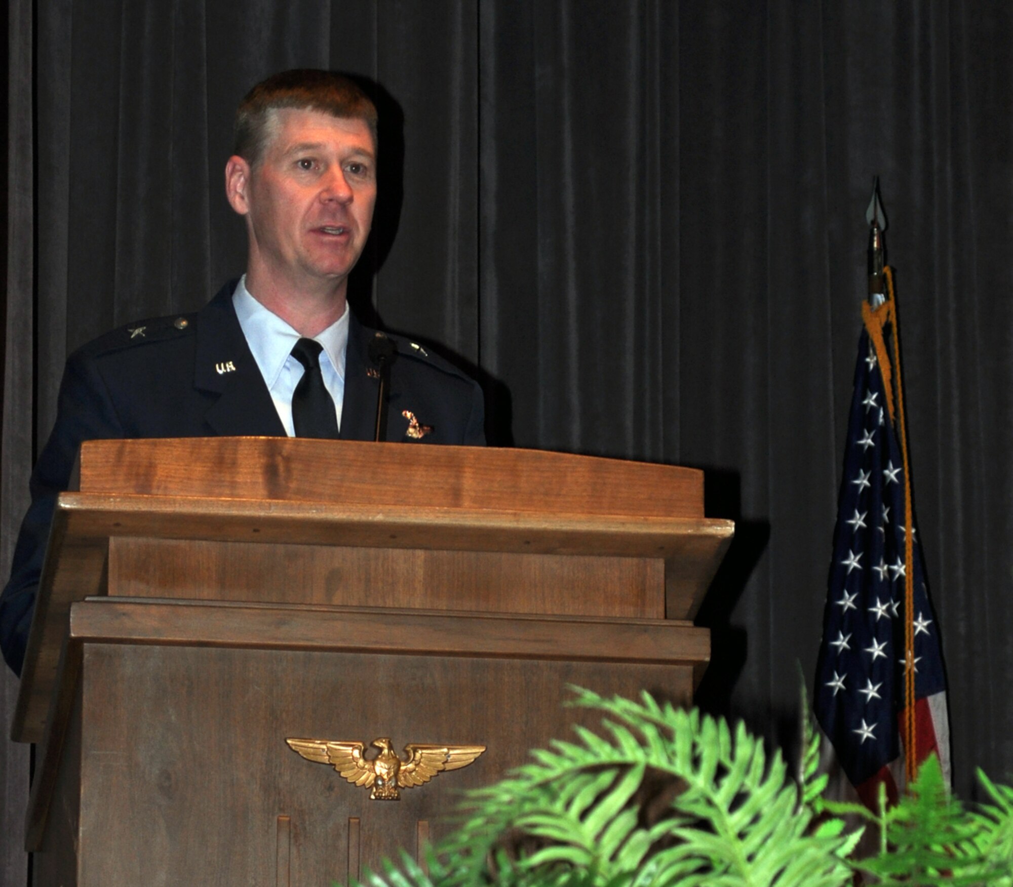 Brig. Gen. William Thornton, director for Air, Space and Information Operations, Air Force Material Command, speaks to the audience at the graduation ceremony for Specialized Undergraduate Pilot Training Class 11-04  Jan. 21 at Kaye Auditorium. (U.S. Air Force photo/Airman 1st Class Chase Hedrick).
