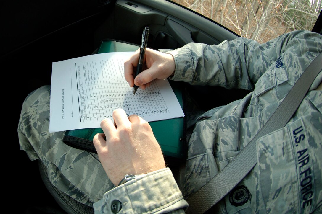 LANGLEY AIR FORCE BASE, Va. – Senior Airman Damion Wiand, 633d Security Forces Squadron patrolman, documents the correct speed of passing vehicles Jan. 25. Security Forces members use radar systems to monitor vehicle speed, visually estimating within five miles of the vehicle’s actual speed. (U.S. Air Force photo/Airman 1st Class Racheal Watson)(RELEASED)