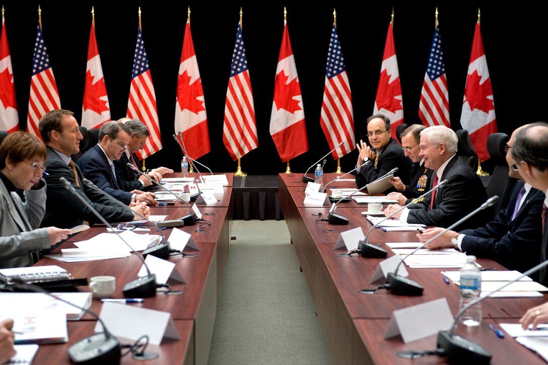 Defense Secretary Robert M. Gates meets with Canadian Defense Minister Peter MacKay at the Old City Hall in Ottawa, Canada, Jan. 27, 2011.