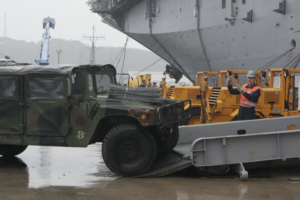 Marines and Sailors with the 31st Marine Expeditionary Unit, and Amphibious Squadron 11, load vehicles and equipment aboard the USS Essex January 28, in preparation for a patrol of the Asia-Pacific Region. The 31st MEU is the only continually forward-deployed MEU, and remains the nation’s force-in-readiness in the Asia-Pacific region.