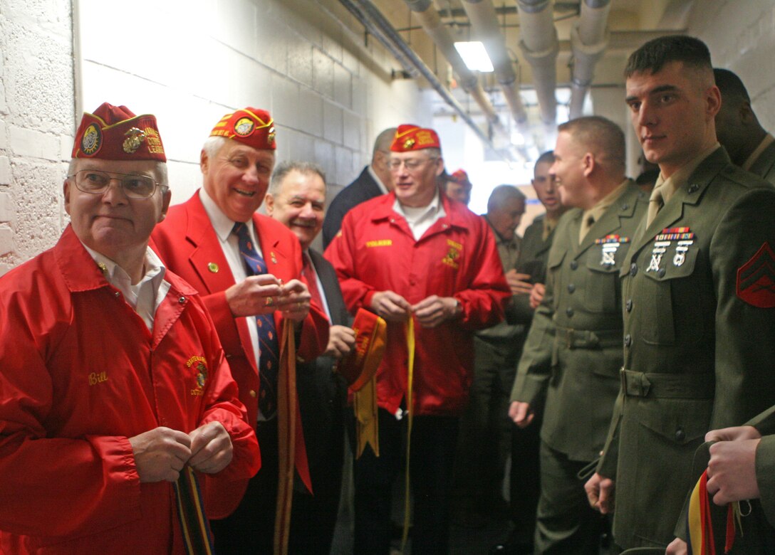 Members of Congress from the House Armed Services Committee strap into the aircraft during their departure from Marine Corps Mountain Warfare Training Center in Bridgeport, Calif., Jan. 28, 2011.