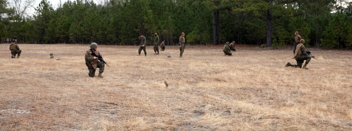 Corpsmen with 2nd Medical Battalion, 2nd Marine Logistics Group, provide security during a field exercise at Landing Zone Robin aboard Camp Lejeune, N.C., Jan. 28, 2011. The purpose of the exercise was to familiarize corpsman with their job in the field and other things they would encounter while on a patrol, which could include providing security, searching the area for improvised explosive devices in addition to tending to victims in a field environment. (U.S. Marine Corps photo by Pfc. Franklin E. Mercado)