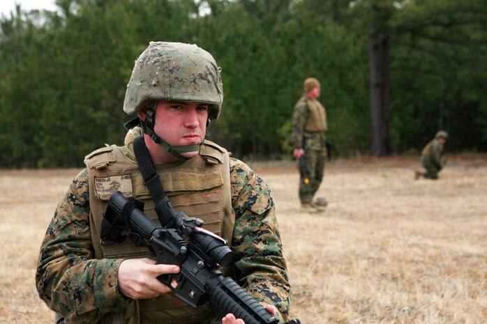 A corpsmen with 2nd Medical Battalion, 2nd Marine Logistics Group, provides security after a simulated improvised explosive device explosion during a field exercise at Landing Zone Robin aboard Camp Lejeune, N.C., Jan. 28, 2011. The purpose of the exercise was to familiarize corpsman with their job in the field and other things they would encounter while on a patrol, which could include providing security, searching the area for improvised explosive devices in addition to tending to victims in a field environment. (U.S. Marine Corps photo by Pfc. Franklin E. Mercado)