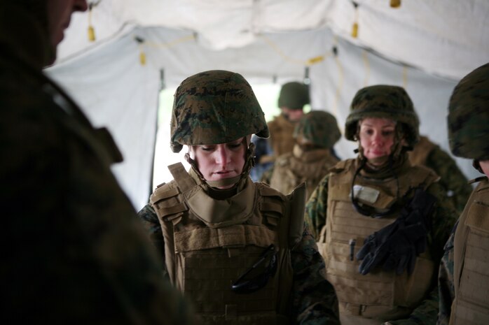 A corpsmen with 2nd Medical Battalion, 2nd Marine Logistics Group, is guided through treating a simulated casualty during a field exercise on Landing Zone Robin aboard Camp Lejeune, N.C., Jan. 28, 2011. The purpose of the exercise was to familiarize corpsman with their job in the field and other things they would encounter while on a patrol, which could include providing security, searching the area for improvised explosive devices in addition to tending to victims in a field environment. (U.S. Marine Corps photo by Pfc. Franklin E. Mercado)