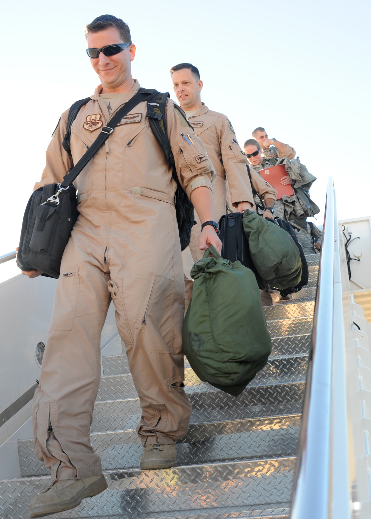 DYESS AIR FORCE BASE, Texas – 7th Bomb Wing Airmen returning from a deployed location in Southwest Asia Jan. 27 depart the aircraft on the tarmac here. The Airmen were deployed to Southwest Asia in support of Operations New Dawn and Enduring Freedom. (U.S. Air Force photo/ Senior Airman Jenifer H. Calhoun)