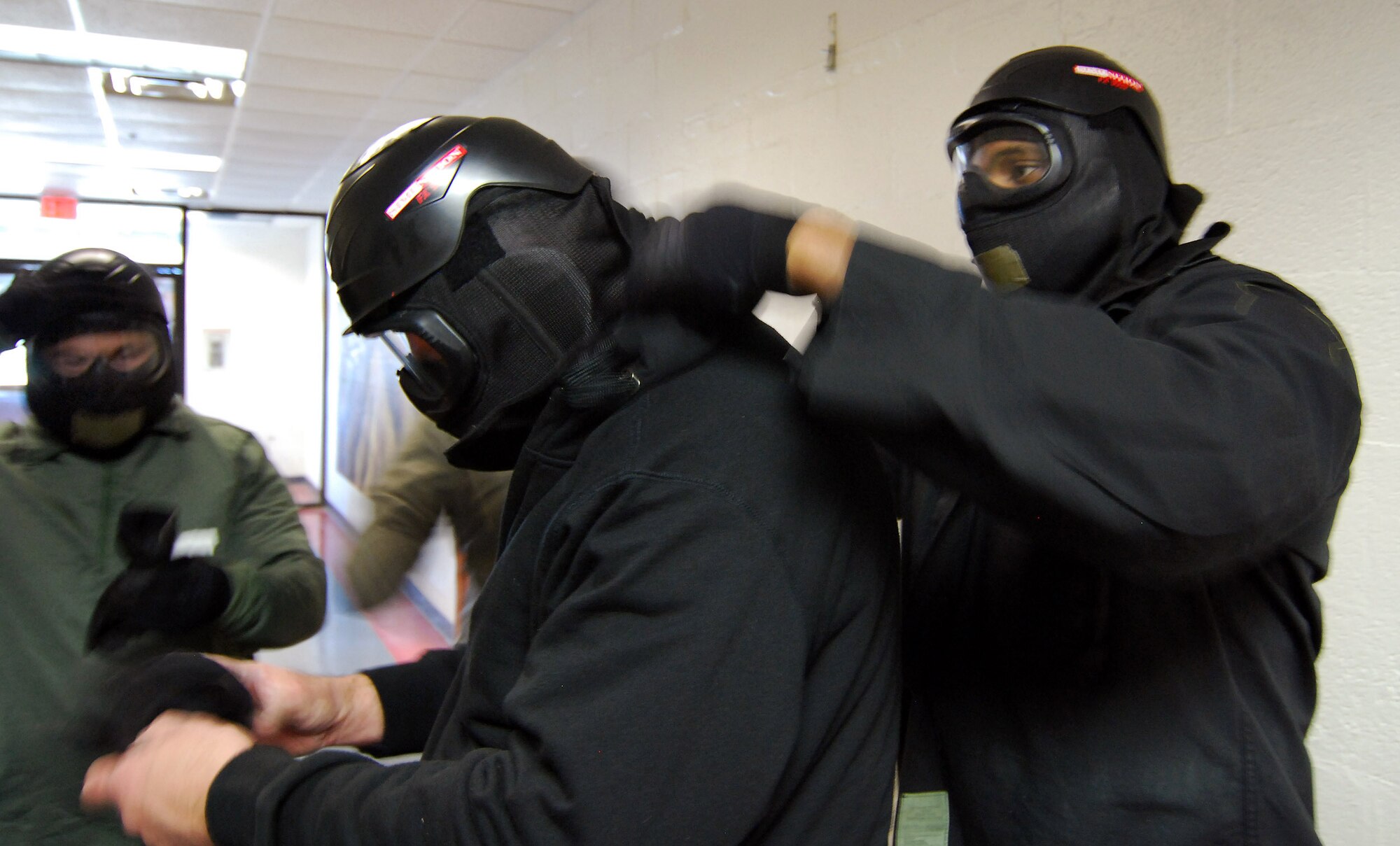 Class participants don the protective equipment required for the Basic Active Shooter Course provided by personnel from the 610th Security Forces Squadron, Joint Reserve Base Fort Worth, Texas, Jan 27.  A 4-man training team came to Dobbins Air Reserve Base to provide this critical training for the 94th Security Forces Squadron and other Dobbins area security personnel.  The two day course provides classroom and tactical instruction to first responders covering several shooting spree scenarios.   (U.S. Air Force photo/ Brad Fallin)