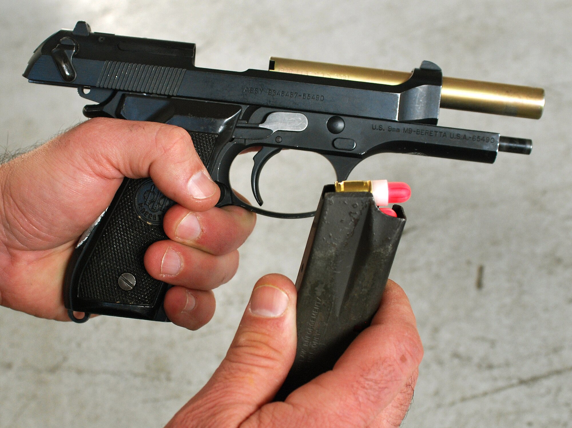The modified M9-Beretta pistol used for the Basic Active Shooter Course fires a powder propelled paint cup to provide the most realistic training possible while maintaining the level of safety required for the scenarios, Jan 27.  The course is taught by a 4-man training team from the 610th Security Forces Squadron, Joint Reserve Base Fort Worth, Texas.  They came to Dobbins Air Reserve Base to provide this critical training for the 94th Security Forces Squadron and other Dobbins area security personnel.  The two day course provides classroom and tactical instruction to first responders covering several shooting spree scenarios.   (U.S. Air Force photo/ Brad Fallin)