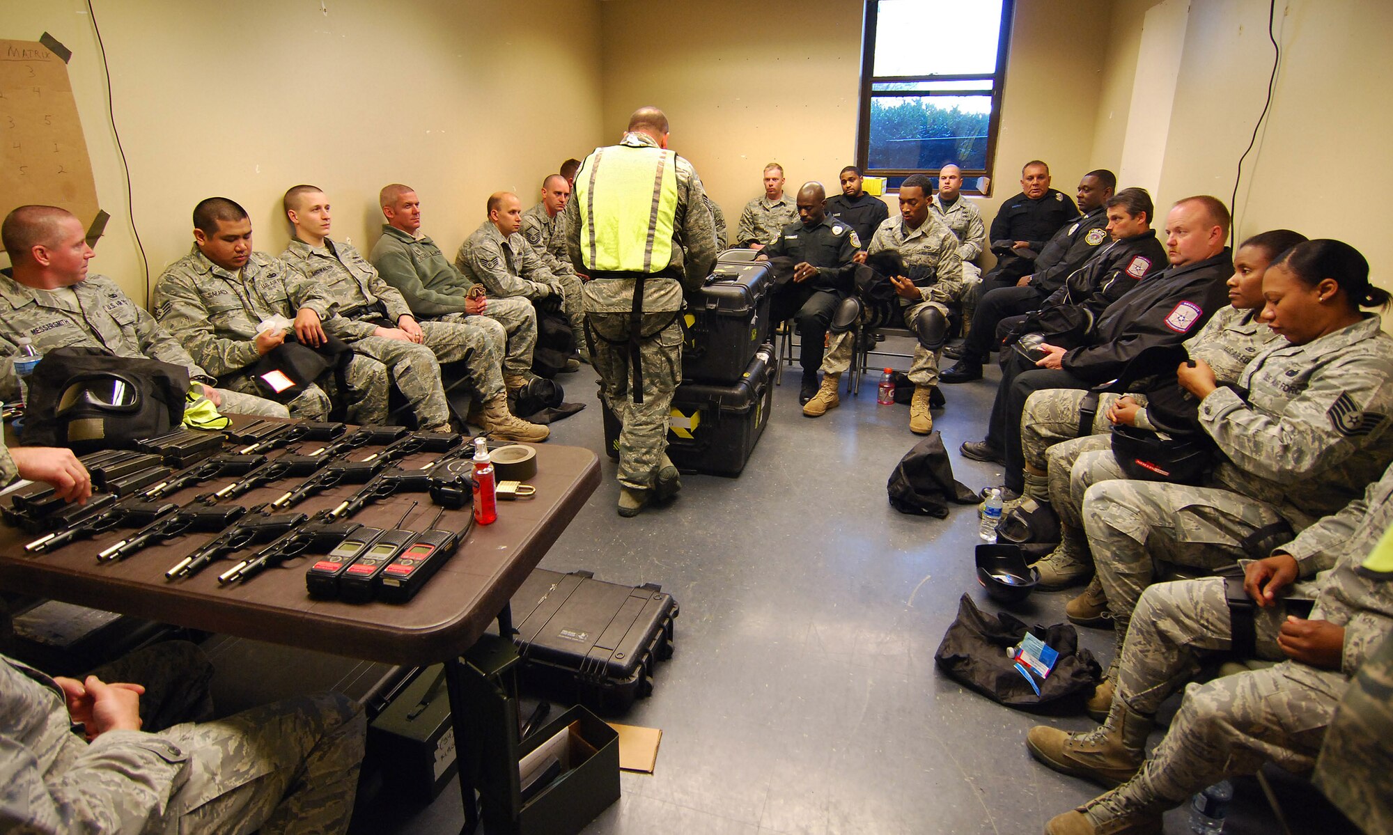 Instructors from the 610th Security Forces Squadron, Joint Reserve Base Fort Worth, Texas, provide a briefing on the use of the safety gear and proper operation of the modified M9 pistols used for the Basic Active Shooter Course, Jan 27.  The 4-man training team came to Dobbins Air Reserve Base to provide this critical training for the 94th Security Forces Squadron and other Dobbins area security personnel.  The two day course provides classroom and tactical instruction to first responders covering several shooting spree scenarios.   (U.S. Air Force photo/ Brad Fallin)