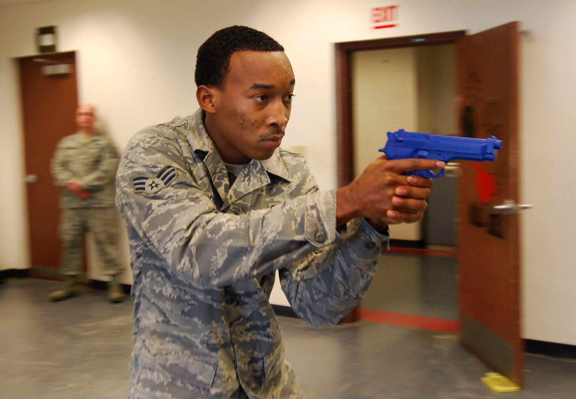 Senior Airman Maurice Thomas practices the proper technique for advancing on a suspect during the Basic Active Shooter Course provided by personnel from the 610th Security Forces Squadron, Joint Reserve Base Fort Worth, Texas, Jan 26.  The 4-man training team came to Dobbins Air Reserve Base to provide this critical training for the 94th Security Forces Squadron and other Dobbins area security personnel.  The two day course provides classroom and tactical instruction to first responders covering several shooting spree scenarios.   (U.S. Air Force photo/ Brad Fallin)