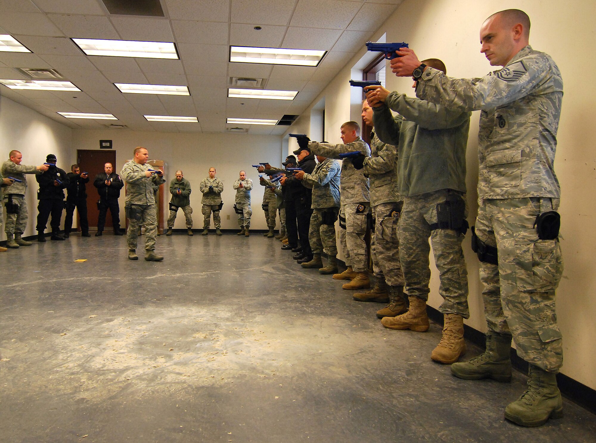 Instructors from the 610th Security Forces Squadron, Joint Reserve Base Fort Worth, Texas, lead a practical training session for the Basic Active Shooter Course, Jan 26.  The 4-man training team came to Dobbins Air Reserve Base to provide this critical training for the 94th Security Forces Squadron and other Dobbins area security personnel.  The two day course provides classroom and tactical instruction to first responders covering several shooting spree scenarios.   (U.S. Air Force photo/ Brad Fallin)