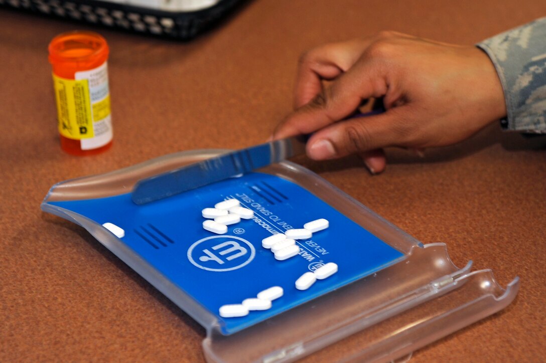 Staff Sgt. Shanika Morris, 28th Medical Support Squadron pharmacy frontline supervisor, counts pills containing hydrocodone bitartrate and acetaminophen at Ellsworth Air Force Base, S.D., Jan. 26, 2011.  The 28th MDSS pharmacy fills nearly 10,000 prescriptions every month. (U.S. Air Force photo/Staff Sgt. Marc I. Lane)
