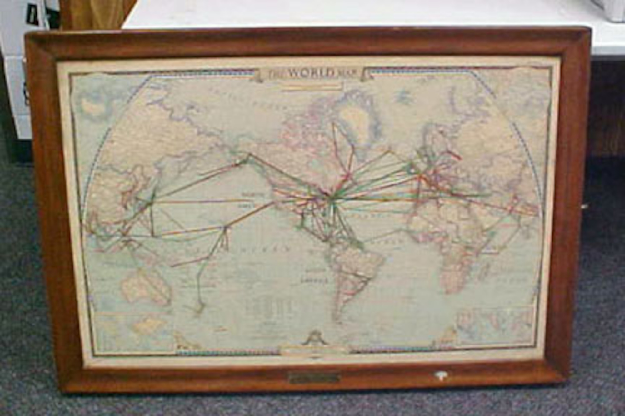 The front of this map case has a world map on it, and the inside cover includes multiple paper maps covering the entirety of the globe in labeled manila pockets. The inside of the case includes 18 rolled maps of various world regions. The map case was presented to Gen. Thomas D. White by the National Geographic Society. Gen. White served as Chief of Staff of the United States Air Force from 1957-1961. (U.S. Air Force photo)