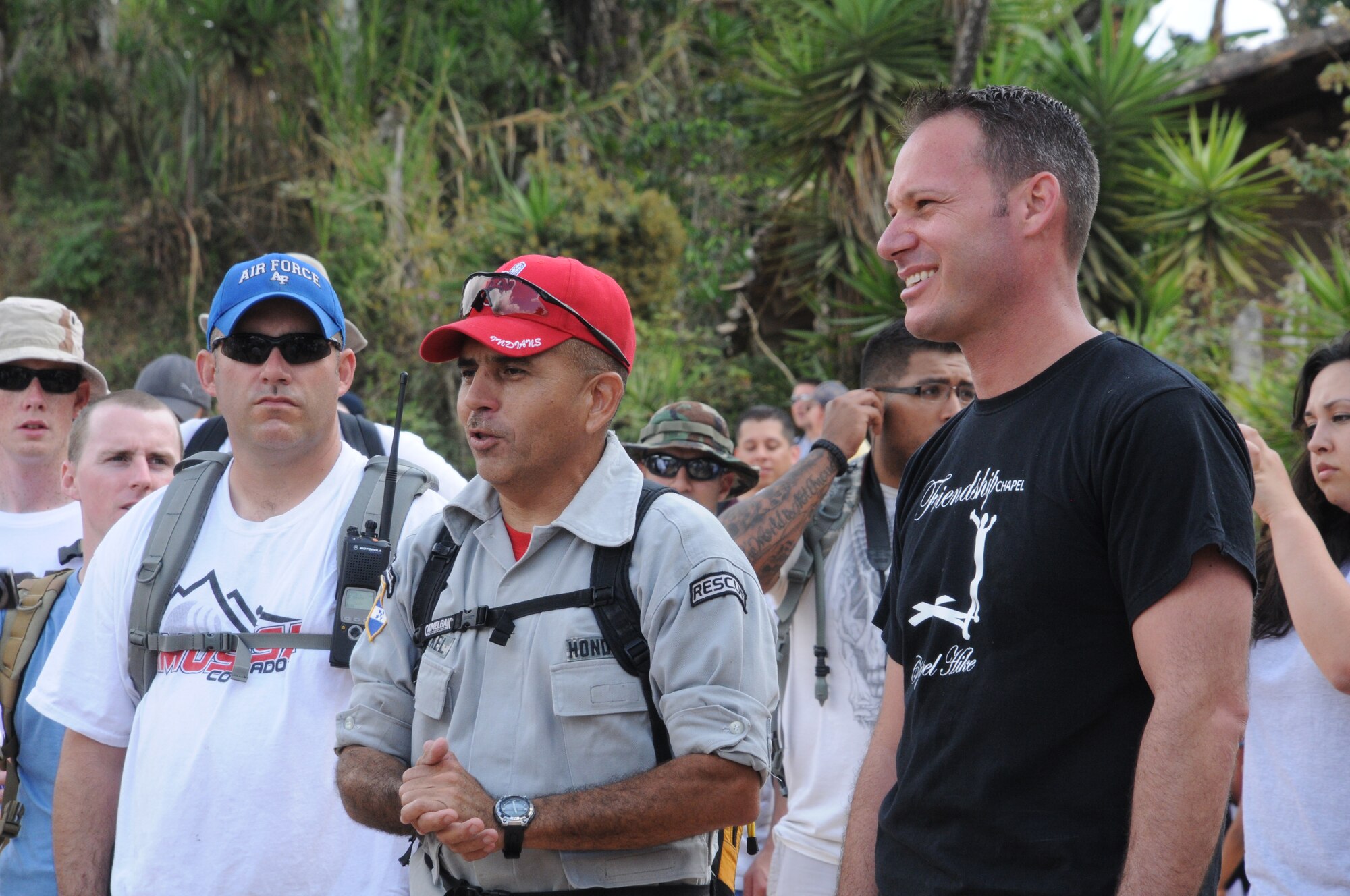 SOTO CANO AIR BASE, Honduras -- Capt. Charles Seligman, Joint Task Force-Bravo chaplain, and Herbert Gaekel, JTF-B fire inspector, address the 107 Chapel Hike volunteers, Jan. 22, following their hike through Las Delicias and Guayabal villages and thank the local villagers for their hospitality. Donations of food and hygiene items we handed out by JTF-B members to those in need. (U.S Air Force photo/Staff Sgt. Kimberly Rae Moore)