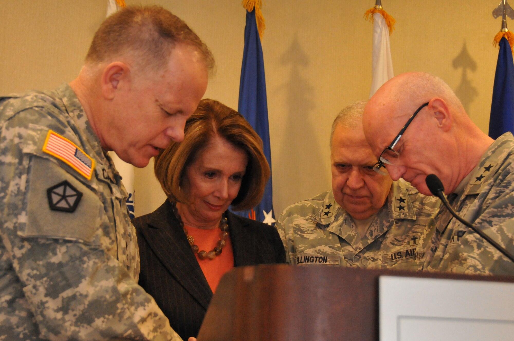Army Maj. Gen. Douglas Carver, the chief of the U.S. Army’s Chaplain Corps (left), Air Force Maj. Gen. Cecil Richardson, the chief of Air Force Chaplains Service and Air Force Maj. Gen. Ellington, the director of the National Guard Chaplain Corps, pray with Congresswoman Nancy Pelosi, minority leader of the House of Representatives, after Pelosi spoke to about 400 chaplains and chaplain assistants at the National Guard’s 2011 Joint Chaplain Conference on Jan. 27, 2011. (U.S. Air Force photo by Tech. Sgt. John Orrell) (Released)