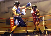 Larry Hampp, Ellsworth Air Force Base, S.D., left, boxes Gary Griffin, Stewart Air National Guard Base, N.Y., during the Air Force Box-offs light heavyweight bout Jan. 22. Hampp won a unanimous decision from the judges. (U.S. Air Force photo/Robbin Cresswell)