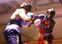 Larry Hampp, Ellsworth Air Force Base, S.D., left, boxes Gary Griffin, Stewart Air National Guard Base, N.Y., during the Air Force Box-offs light heavyweight bout Jan. 22. Hampp won a unanimous decision from the judges. (U.S. Air Force photo/Robbin Cresswell)