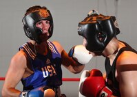 Lightweight James Barber (left), Tinker Air Force Base, Okla., competes with Saul Montes during the Air Force Box-offs Jan. 22 at the Bennett Fitness Center. Barber lost the decision. (U.S. Air Force photo/Robbin Cresswell)