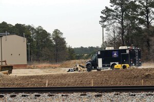The Yorktown Naval Weapons Station Explosive Ordnance Disposal Team responded to the Harrison Causeway Project construction site on Harrison Road, Fort Eustis, where three unexploded ordnance munitions were uncovered by an excavator Monday. The EOD determined the UXOs to be safe for removal and transported them to Yorktown Naval Weapons Station for disposition. (Photo by Lyna Tucker)

